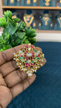 Celebrate the rich legacy of Indian craftsmanship with this exquisite Jadau pendant, meticulously detailed to bridge vintage heritage with contemporary style.