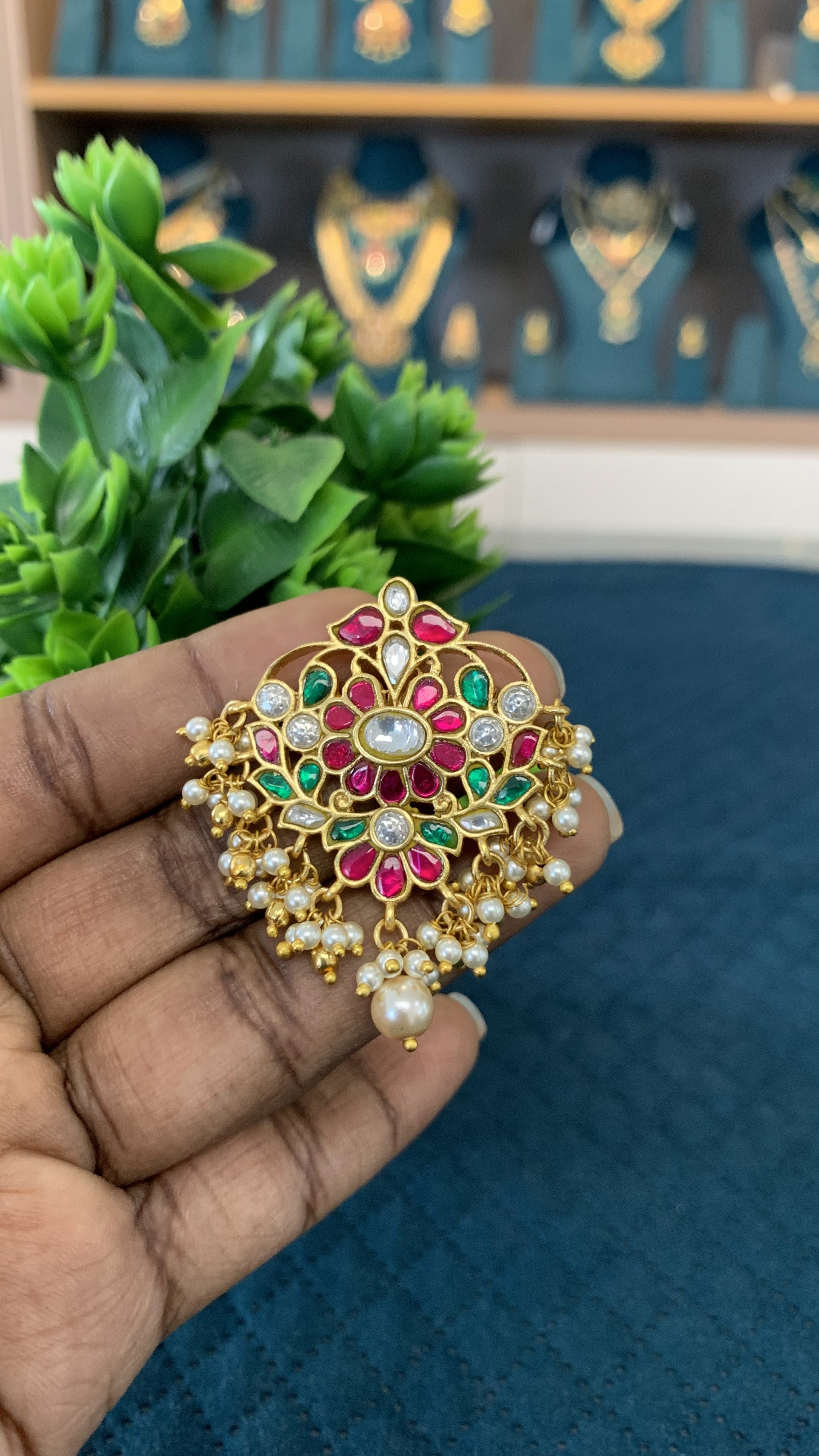 Celebrate the rich legacy of Indian craftsmanship with this exquisite Jadau pendant, meticulously detailed to bridge vintage heritage with contemporary style.